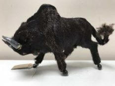 A miniature figure of a Bison covered in real fur