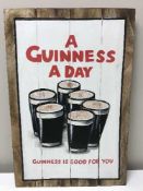 A hand painted panel - a Guinness a day,