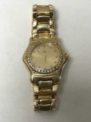 A Lady's 18ct gold Ebel wristwatch with diamond dial and bezel, 85g.