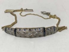 An Art deco diamond and sapphire bracelet set in yellow and white gold