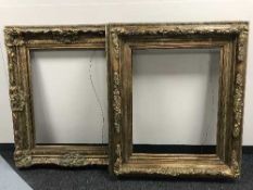 A pair of ornate gilt frames