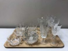 Two trays containing a large quantity of lead crystal and glassware including grapefruit bowls,