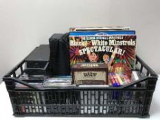 A basket containing a quantity of assorted LP's, CD's and DVD.