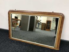 A Victorian inlaid mahogany mirror