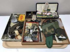 A tray of military badges, patches, buttons together with coins, monochrome photo albums, pipe,