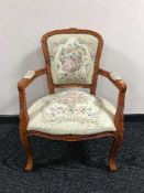 A floral tapestry upholstered armchair