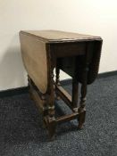 An oak gateleg table