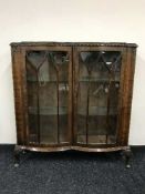 A mahogany double door display cabinet