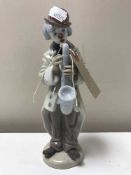 A Lladro figure of a Clown playing a Saxophone No.