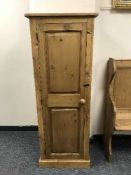A reclaimed pine single door cupboard