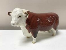 A Beswick figure - Hereford Bull, model 1363A, First Version (horns protrude from ears), gloss.