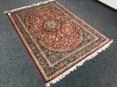 A Persian Kashan rug 230 cm x 160 cm