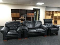 A three piece suite upholstered in blue leather comprising of two seater settee,