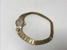 A 9ct gold lady's Rotary wristwatch on 9ct strap, 15.