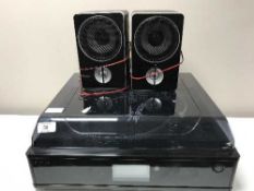 A Neostar electronics turntable together with a pair of speakers, headphones,