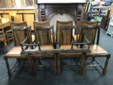 A set of four oak dining chairs and oak fire curb