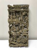 Carved Eastern panel depicting fighting warriors