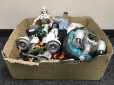 A box of Action Men and accessories