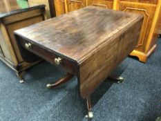 A Victorian mahogany flap sided sofa table