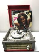 A mid twentieth century Dansette table top record player together with a box of lps