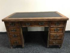 A late Victorian mahogany leather topped writing desk