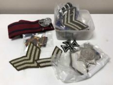 A collection of army rank badges,