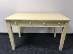 A painted oak kitchen table fitted with two drawers