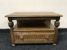 An Ercol flap sided coffee table fitted with a drawer