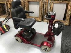 A Roma disability cart with key and charger