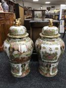 A pair of impressive lidded oriental temple jars