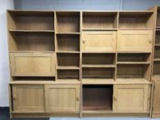 Two sets of contemporary bookshelves fitted with cupboards