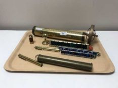 A tray of brass kaleidoscopes