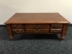 A contemporary colonial style coffee table fitted with drawers