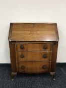 A walnut Queen Ann style writing bureau