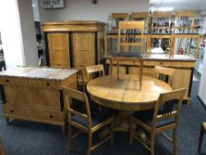 An impressive continental satinwood and ebonised sixteen piece dining room suite comprising of