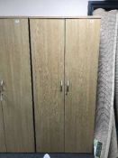 A double door office stationary cupboard