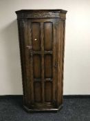 A carved oak hall wardrobe