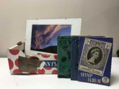 A box of six framed prints and stamps relating to New Zealand and three albums of stamps