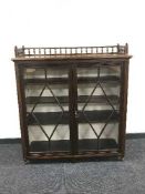 An antique mahogany glazed door bookcase