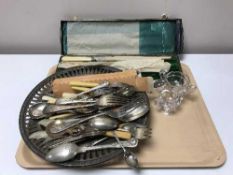 A tray of plated serving plates, carving set,