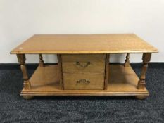 A contemporary oak coffee table fitted with drawers
