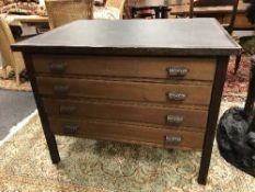 An oak four drawer printer's chest
