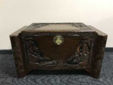 A heavily carved camphor wood box