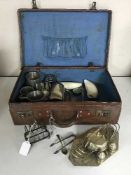 A vintage leather suitcase containing a pair of plated toast racks, tankards, other collectables,
