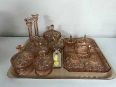 A tray of pink glass dressing table sets