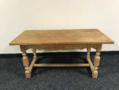 A blonde oak refectory coffee table