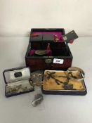 A jewellery box containing a silver bangle, silver token, Victorian rolled gold bangle, dress rings,