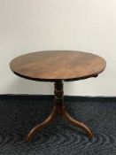 A Victorian pedestal occasional table