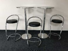 A pair of poser bar tables and three metal stools