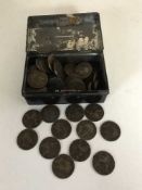 A tin containing a quantity of English coins;
